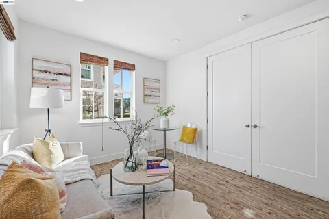 a bedroom with a bed and a potted plant
