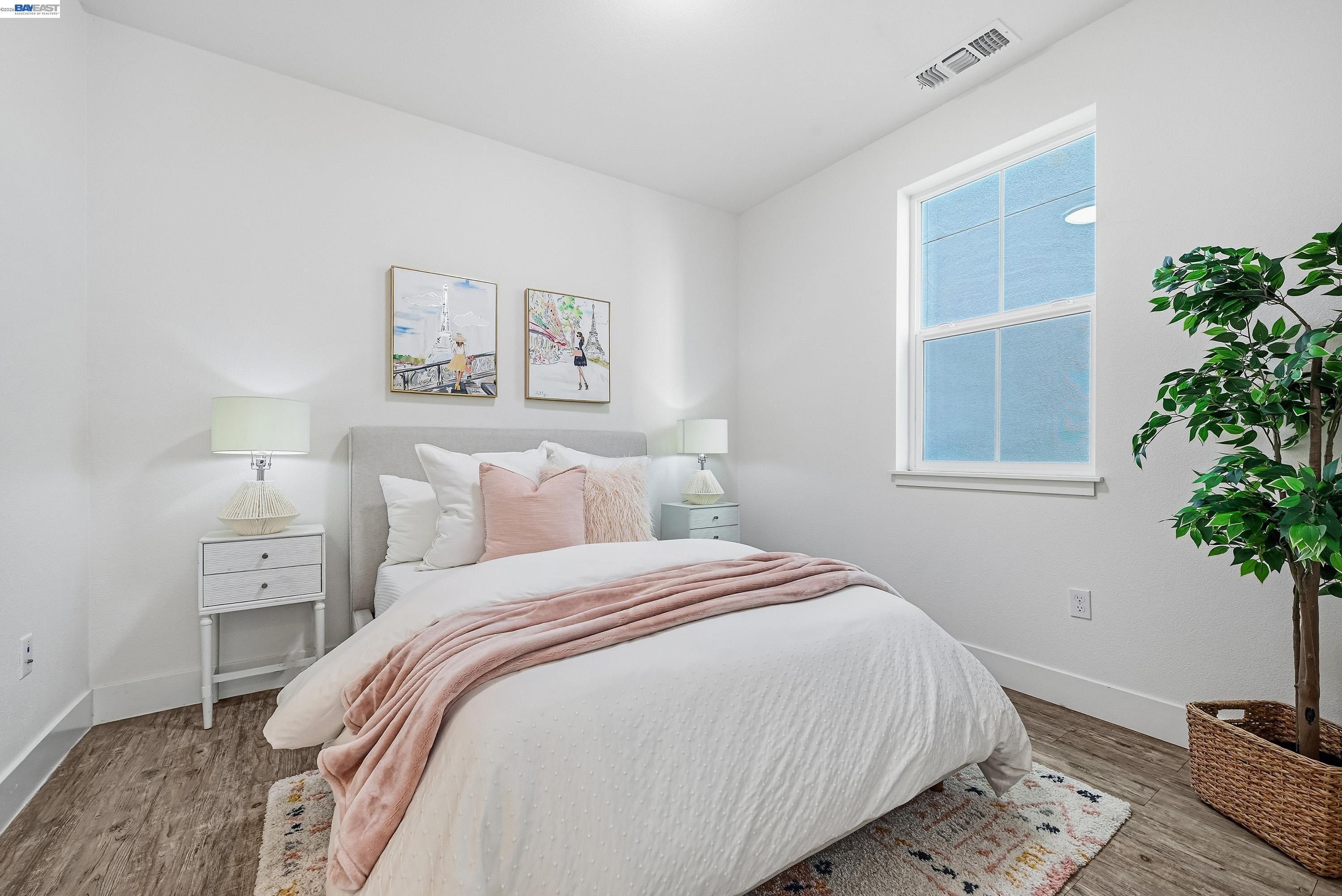 37541 Bay Crest Road Newark, CA 94560 - Photo 23 of 50 a bedroom with a bed and a potted plant