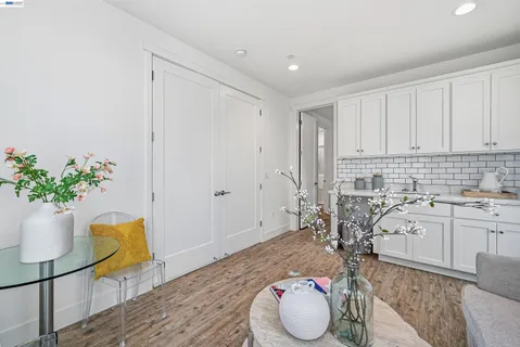 a bedroom with a bed and a potted plant