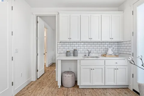 a bedroom with a bed and a potted plant
