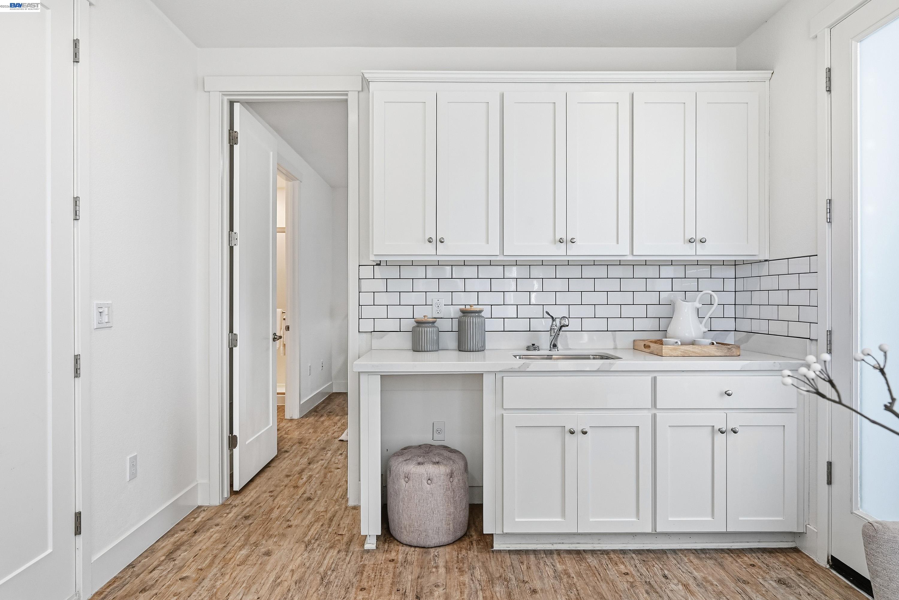37541 Bay Crest Road Newark, CA 94560 - Photo 25 of 50 a kitchen with white cabinets a sink and dishwasher