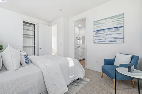 a white toilet sitting next to a bath tub