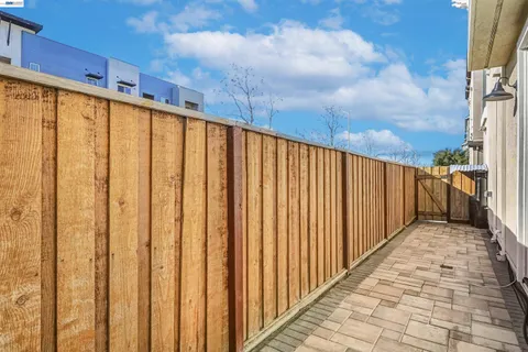 a kitchen with a stove top oven cabinets and a fireplace