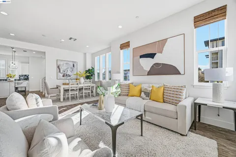 a living room with furniture and a painting