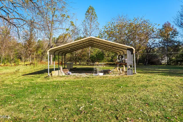 a view of swimming pool with a yard