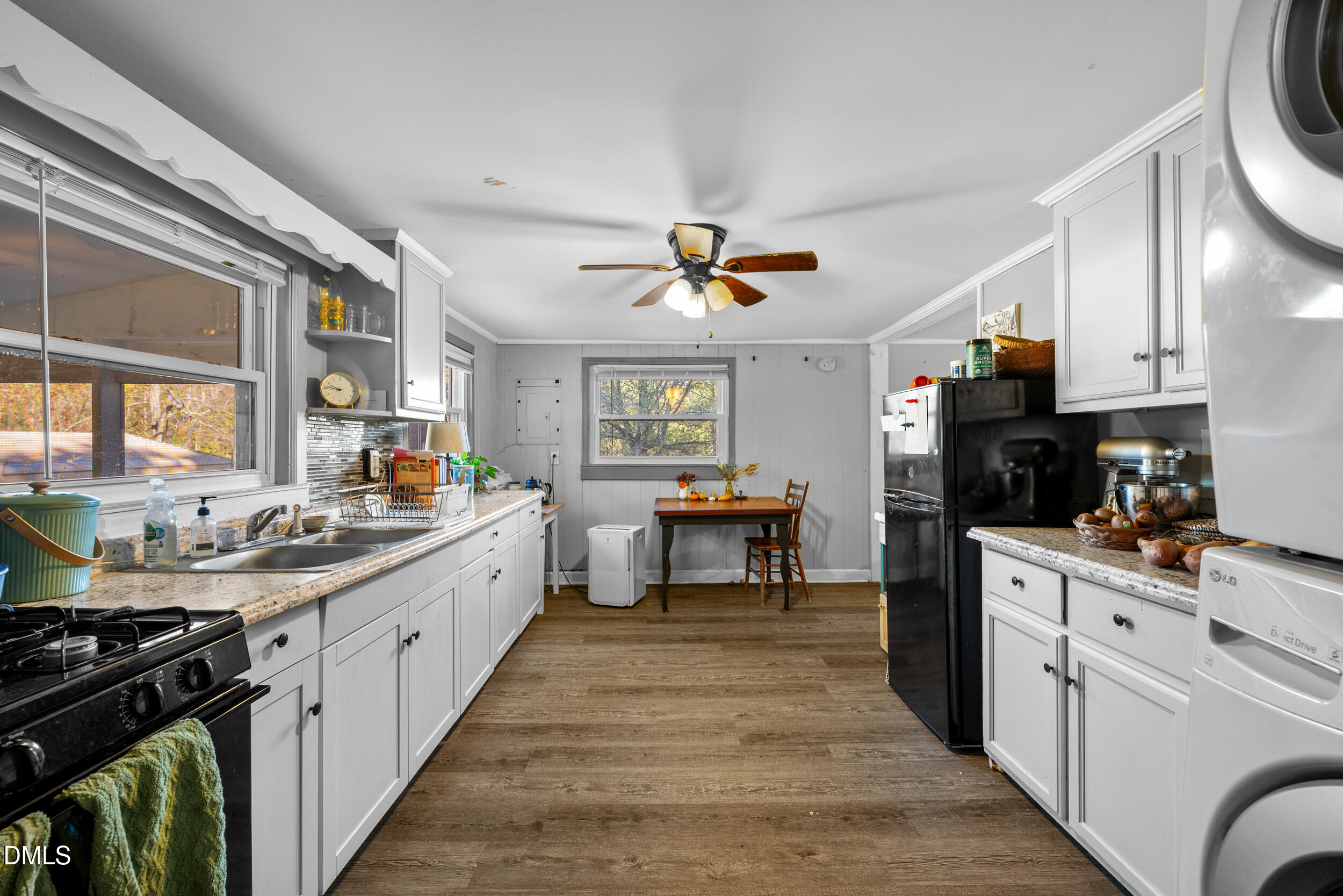 2707 Moorefields Road Hillsborough, NC 27278 - Photo 5 of 36 a kitchen with a stove a sink and a refrigerator