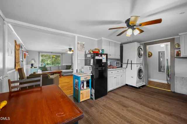 a view of a living room and workspace