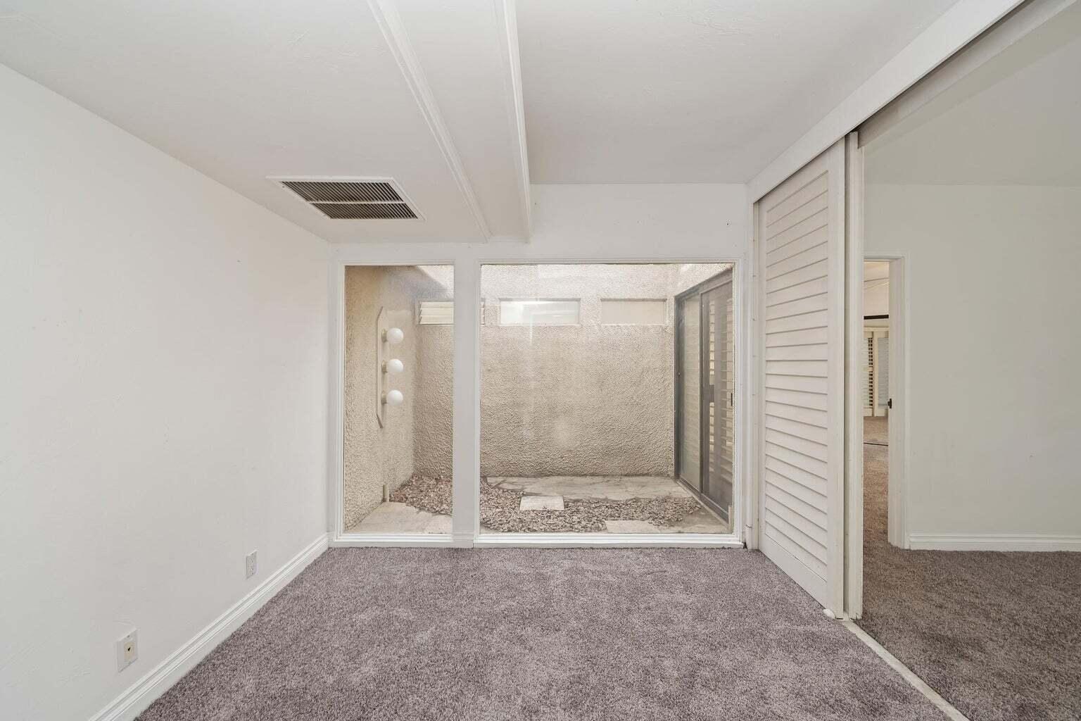 71861 Eleanora Lane Rancho Mirage, CA 92270 - Photo 13 of 22 a view of a bathroom with a glass door and shower