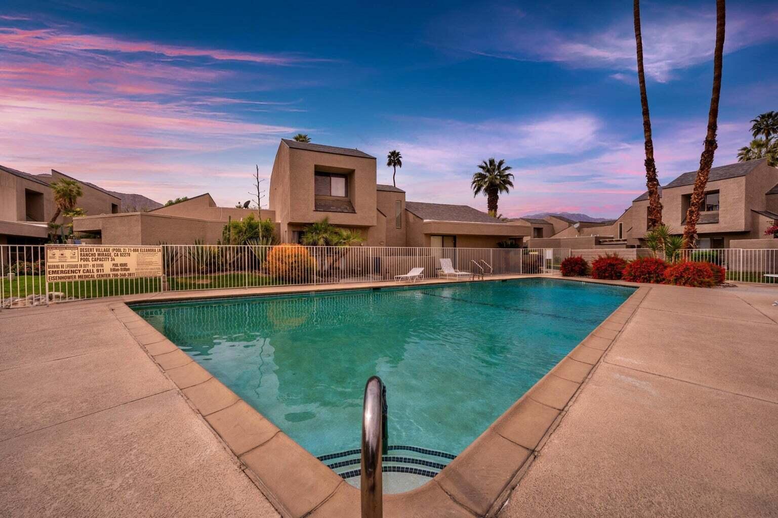71861 Eleanora Lane Rancho Mirage, CA 92270 - Photo 19 of 22 a front view of a house with a yard table and chairs