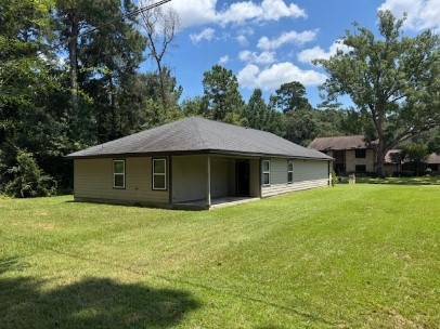611 Foxmeadows Lane Cleveland, TX 77327 - Photo 11 of 13 a house that has a big yard