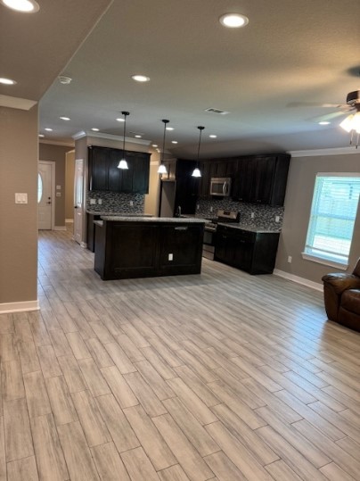 611 Foxmeadows Lane Cleveland, TX 77327 - Photo 13 of 13 a large room with wooden floor