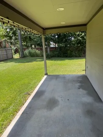 a view of a yard with an outdoor space