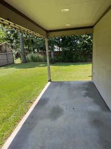 a view of a yard with an outdoor space