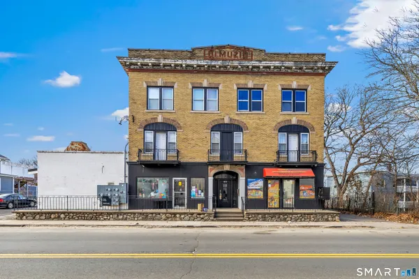 a front view of residential houses with street