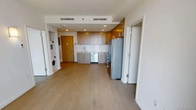 a view of a hallway with wooden shelves