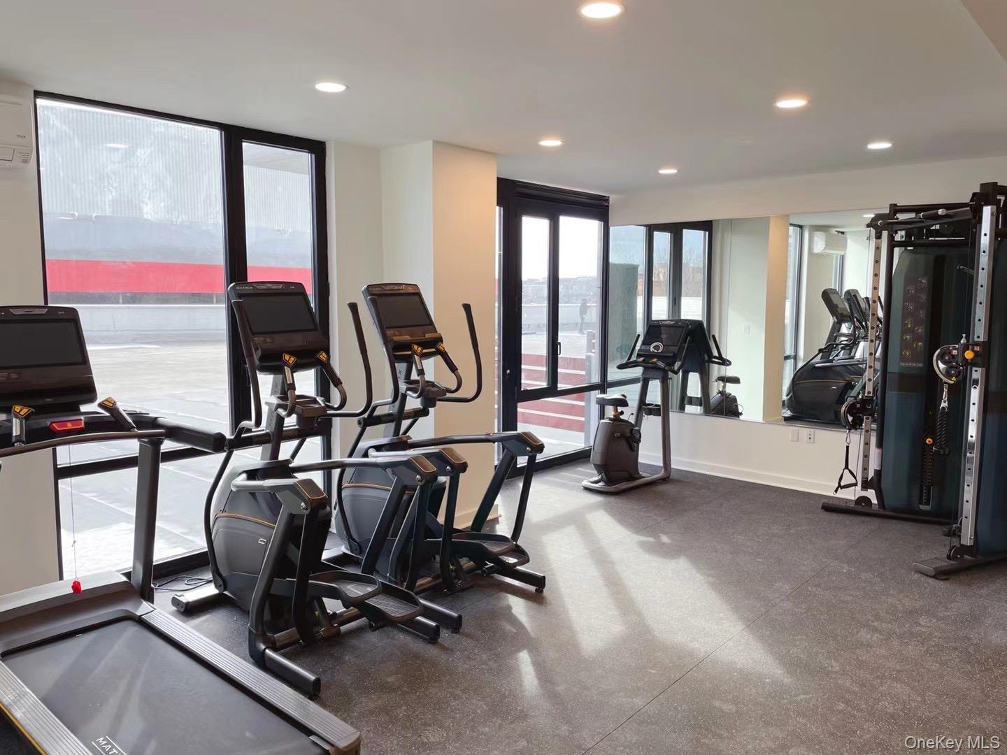 8808 Justice Avenue, Unit 13M Queens, NY 11373 - Photo 6 of 11 a view of a room with gym equipment