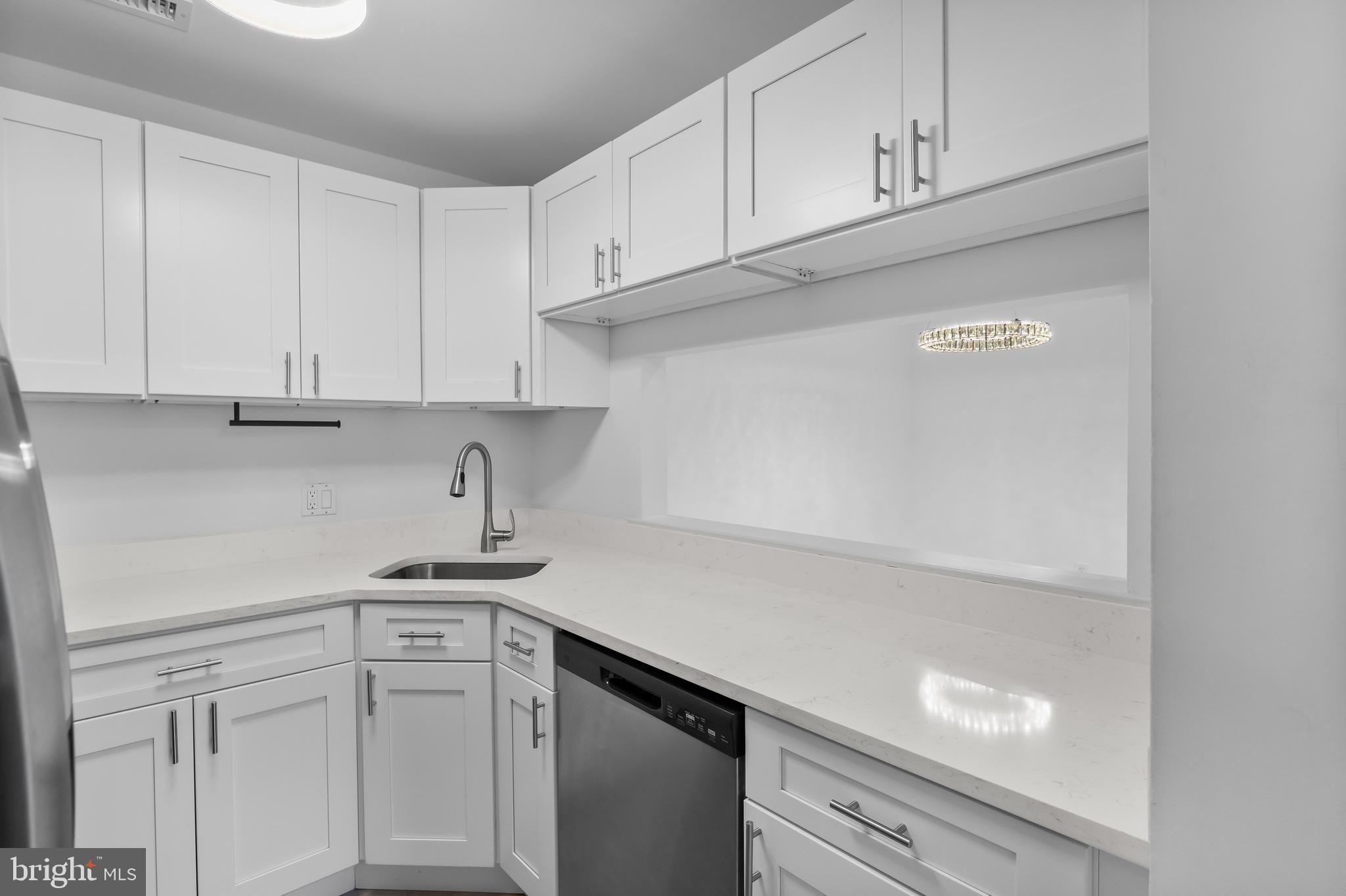 4912 B Dunbarton Road Mount Laurel, NJ 08054 - Photo 11 of 21 a kitchen with white cabinets and a sink