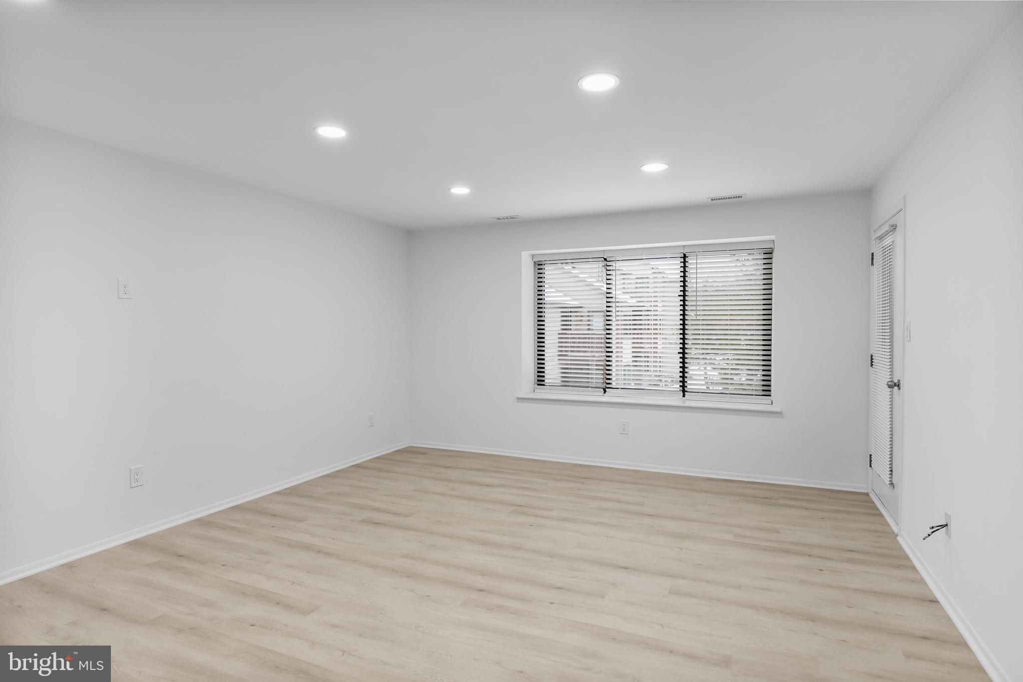 4912 B Dunbarton Road Mount Laurel, NJ 08054 - Photo 6 of 21 an empty room with wooden floor and windows