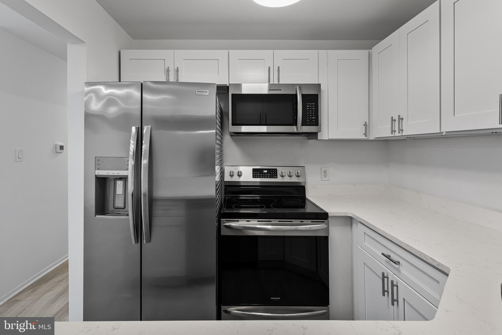 4912 B Dunbarton Road Mount Laurel, NJ 08054 - Photo 10 of 21 a kitchen with stainless steel appliances white cabinets and a refrigerator