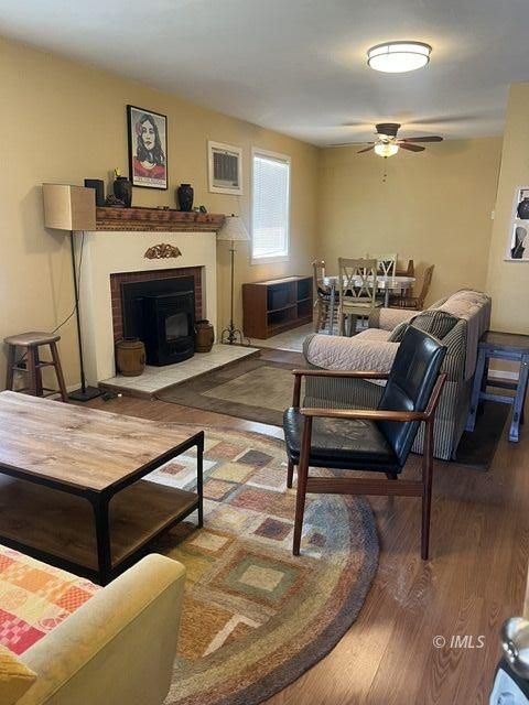 103 North Clay Street Independence, CA 93526 - Photo 9 of 25 a living room with furniture and a fireplace