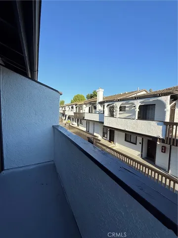 a view of a balcony with city view
