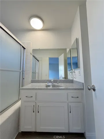 a bathroom with a sink and mirror