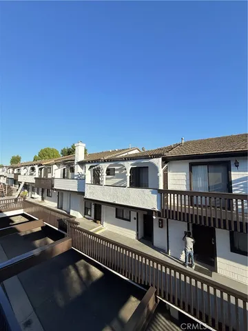 a view of a house with wooden deck
