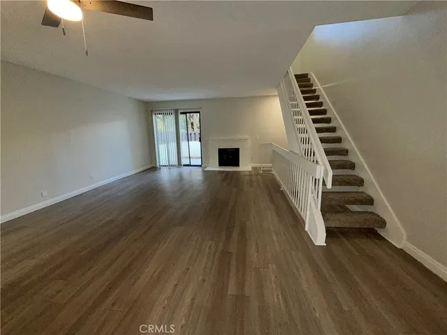 a view of wooden floor and staircase in a room