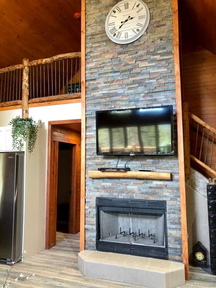 121 Claudius Road Black Hawk, CO 80422 - Photo 8 of 29 a view of fireplace and wooden floor