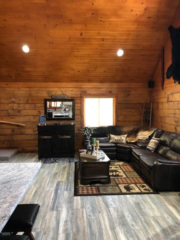 121 Claudius Road Black Hawk, CO 80422 - Photo 9 of 29 a living room with couches and kitchen view