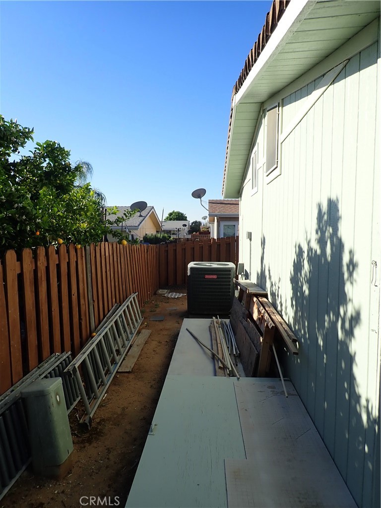 27250 Murrieta Road, Unit 386 Menifee, CA 92586 - Photo 27 of 32 a balcony with wooden floor and outdoor seating