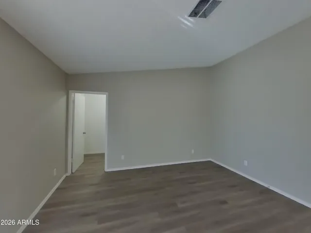 a view of a kitchen with a sink and a window