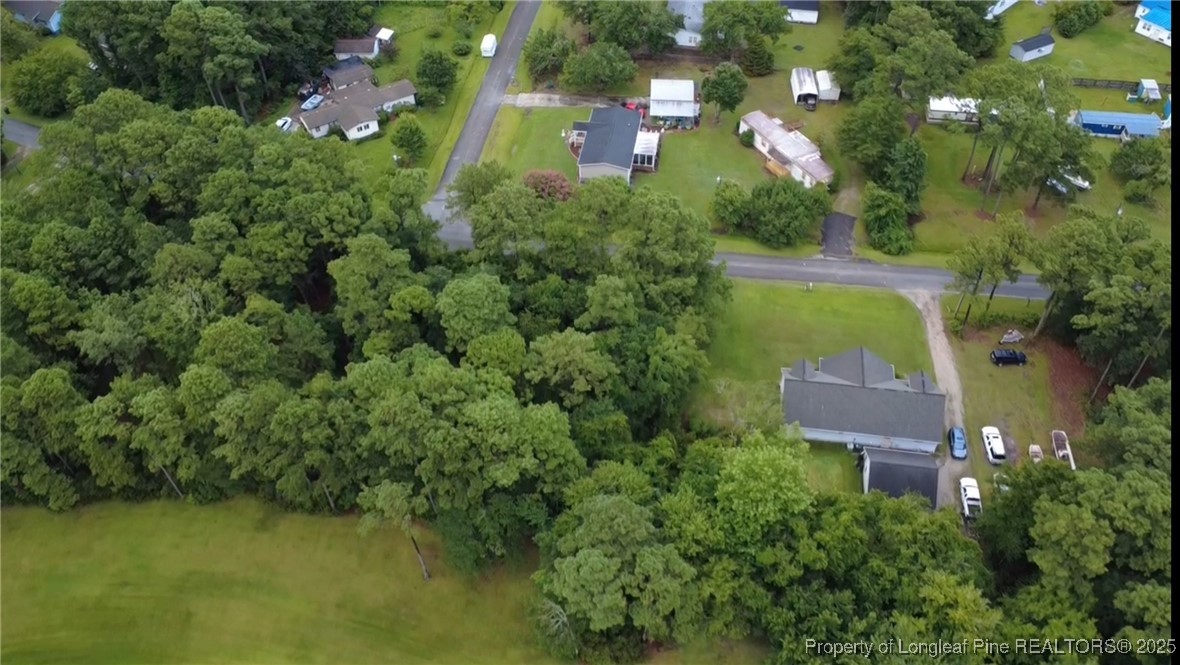 202 Pettiford Road Peletier, NC 28584 - Photo 1 of 12 an aerial view of residential house with outdoor space and trees all around