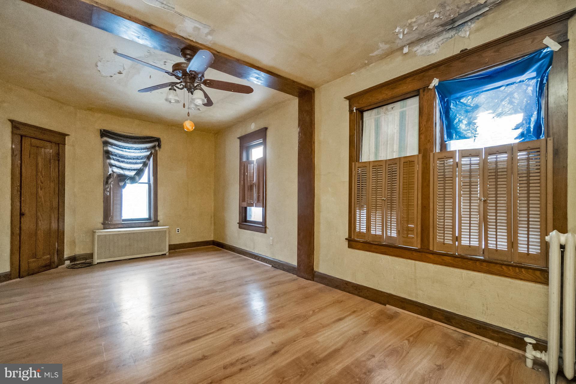 446 Williams Street Easton, PA 18042 - Photo 17 of 37 a view of an empty room with wooden floor and a window