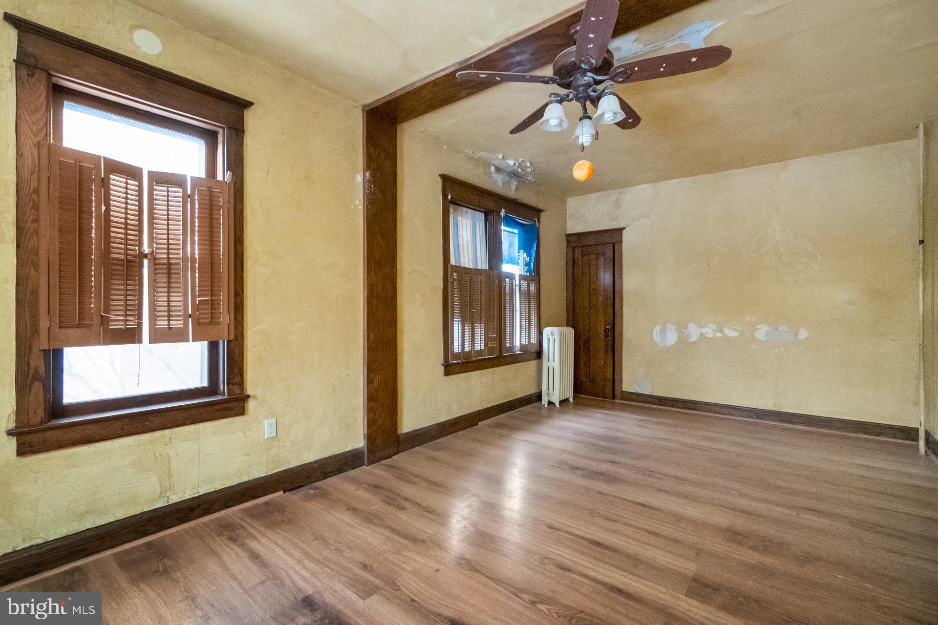 446 Williams Street Easton, PA 18042 - Photo 20 of 37 a view of an empty room with a window and wooden floor