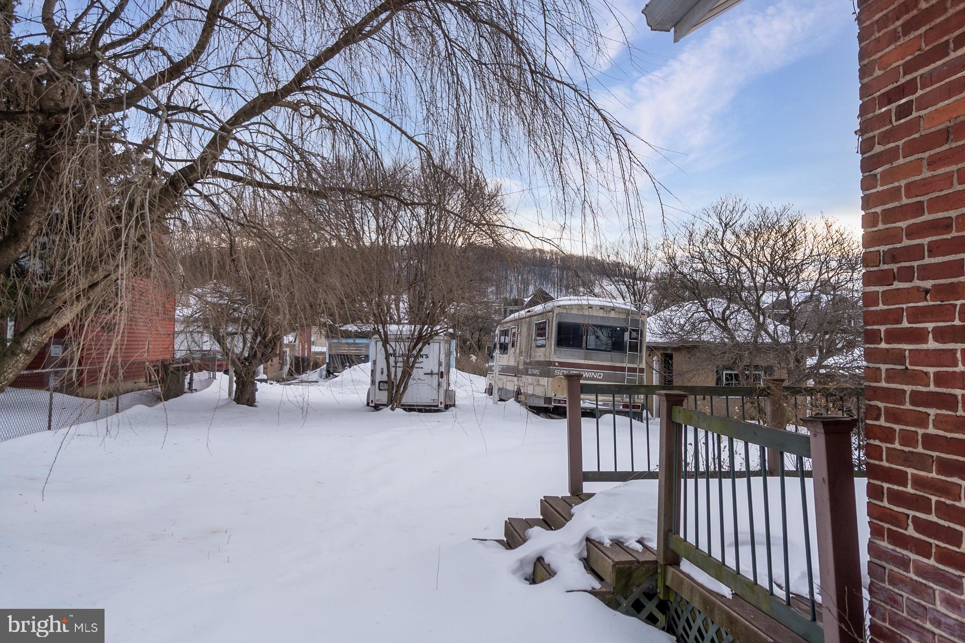 446 Williams Street Easton, PA 18042 - Photo 35 of 37 a view of a patio with a table and chairs and potted plants