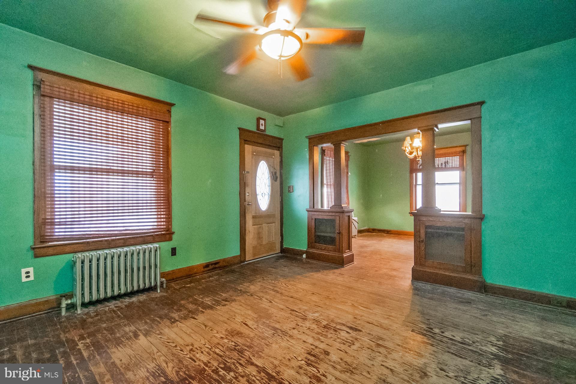 446 Williams Street Easton, PA 18042 - Photo 6 of 37 a view of an empty room with window hardwood and kitchen