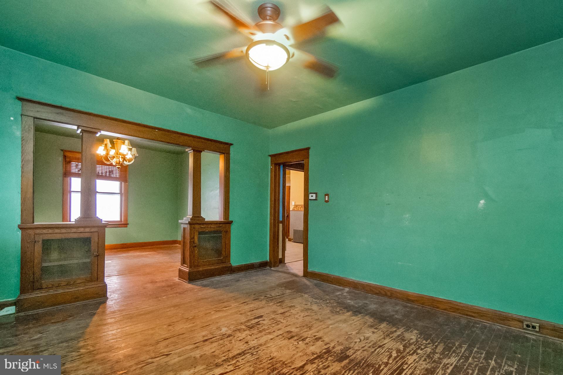 446 Williams Street Easton, PA 18042 - Photo 7 of 37 a view of an empty room with window and chandelier fan