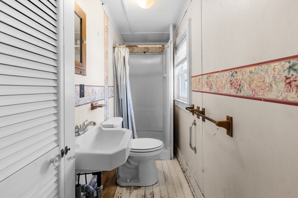 7 Silver Shell Beach Drive Fairhaven, MA 02719 - Photo 19 of 35 a bathroom with a sink toilet and shower