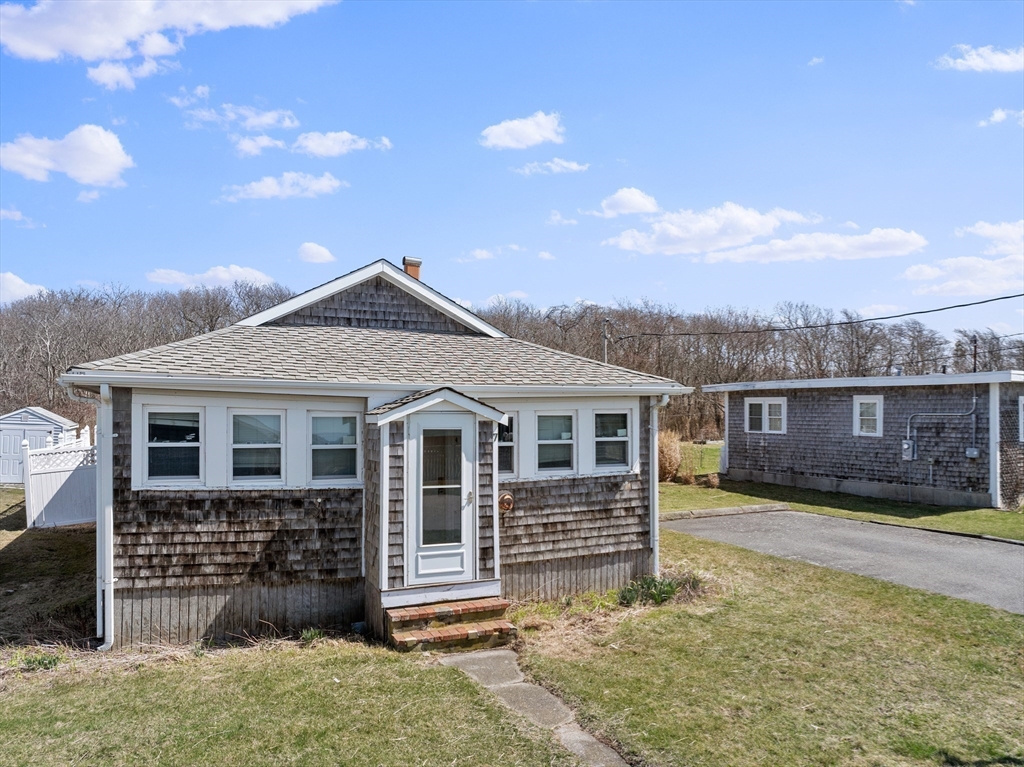 7 Silver Shell Beach Drive Fairhaven, MA 02719 - Photo 22 of 35 front view of a house with a yard