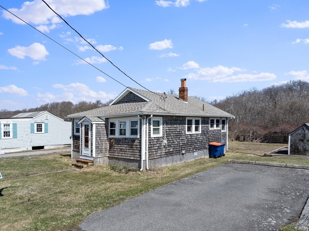 7 Silver Shell Beach Drive Fairhaven, MA 02719 - Photo 6 of 35 a front view of a house with a yard