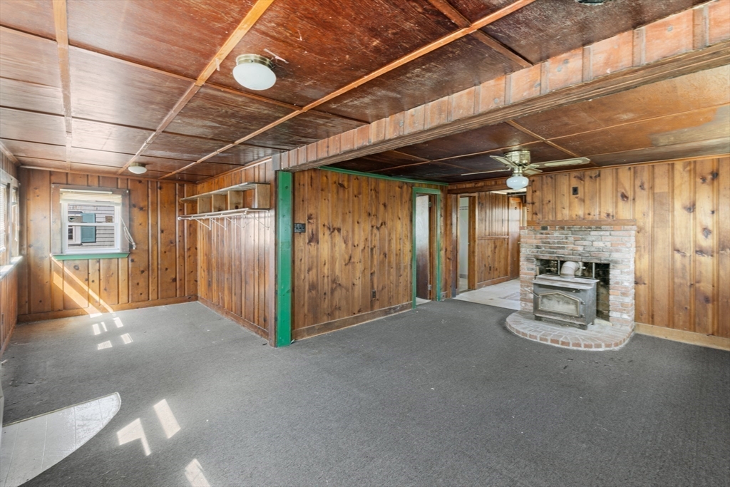7 Silver Shell Beach Drive Fairhaven, MA 02719 - Photo 7 of 35 a view of an empty room with a fireplace