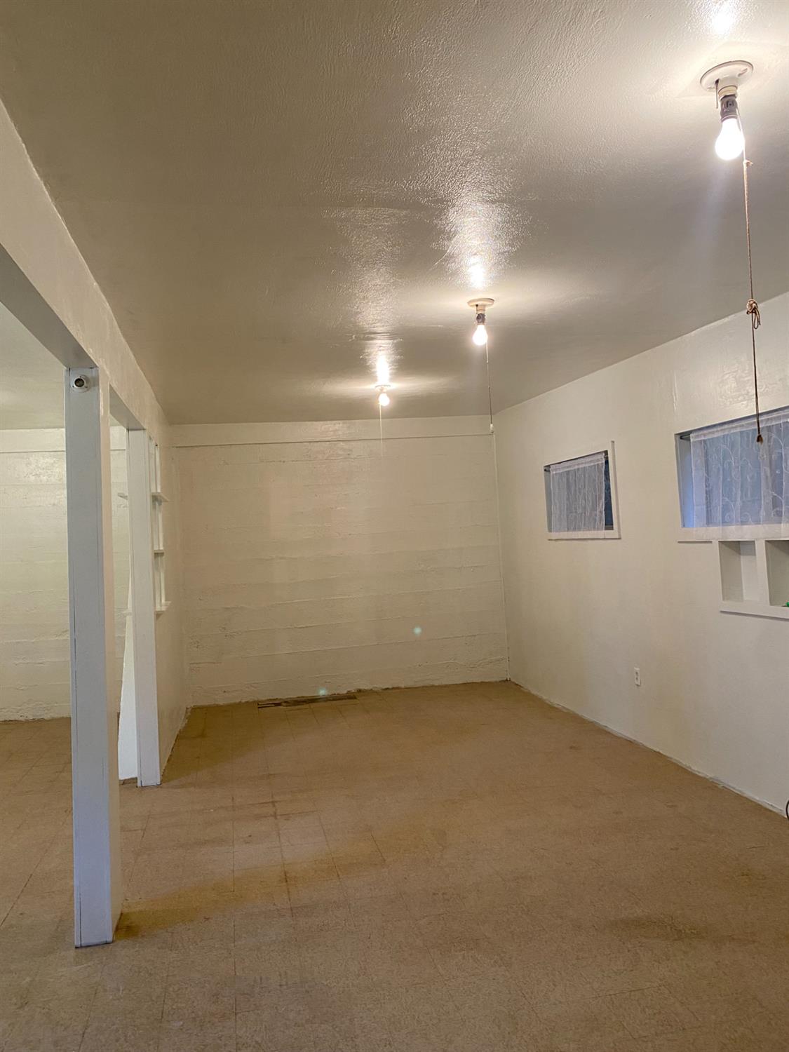 14105 River Road Walnut Grove, CA 95690 - Photo 13 of 41 an empty room with a empty space and windows