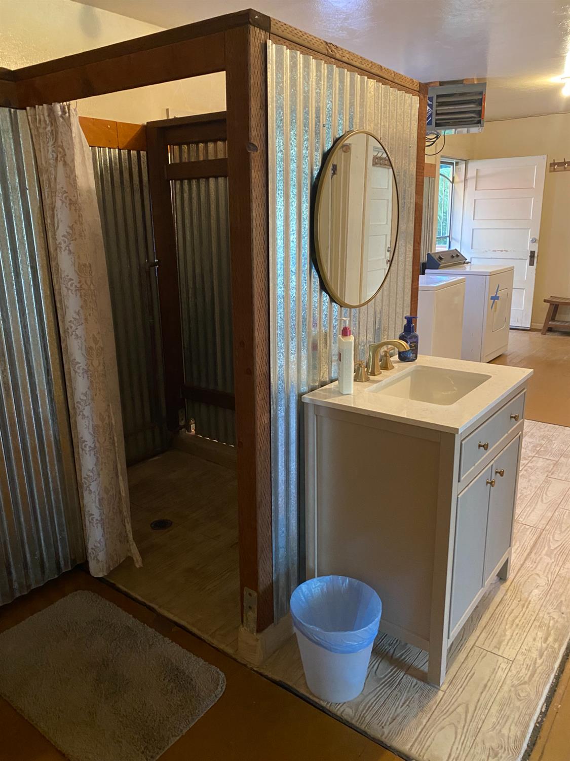 14105 River Road Walnut Grove, CA 95690 - Photo 17 of 41 a bathroom with a sink toilet and a mirror