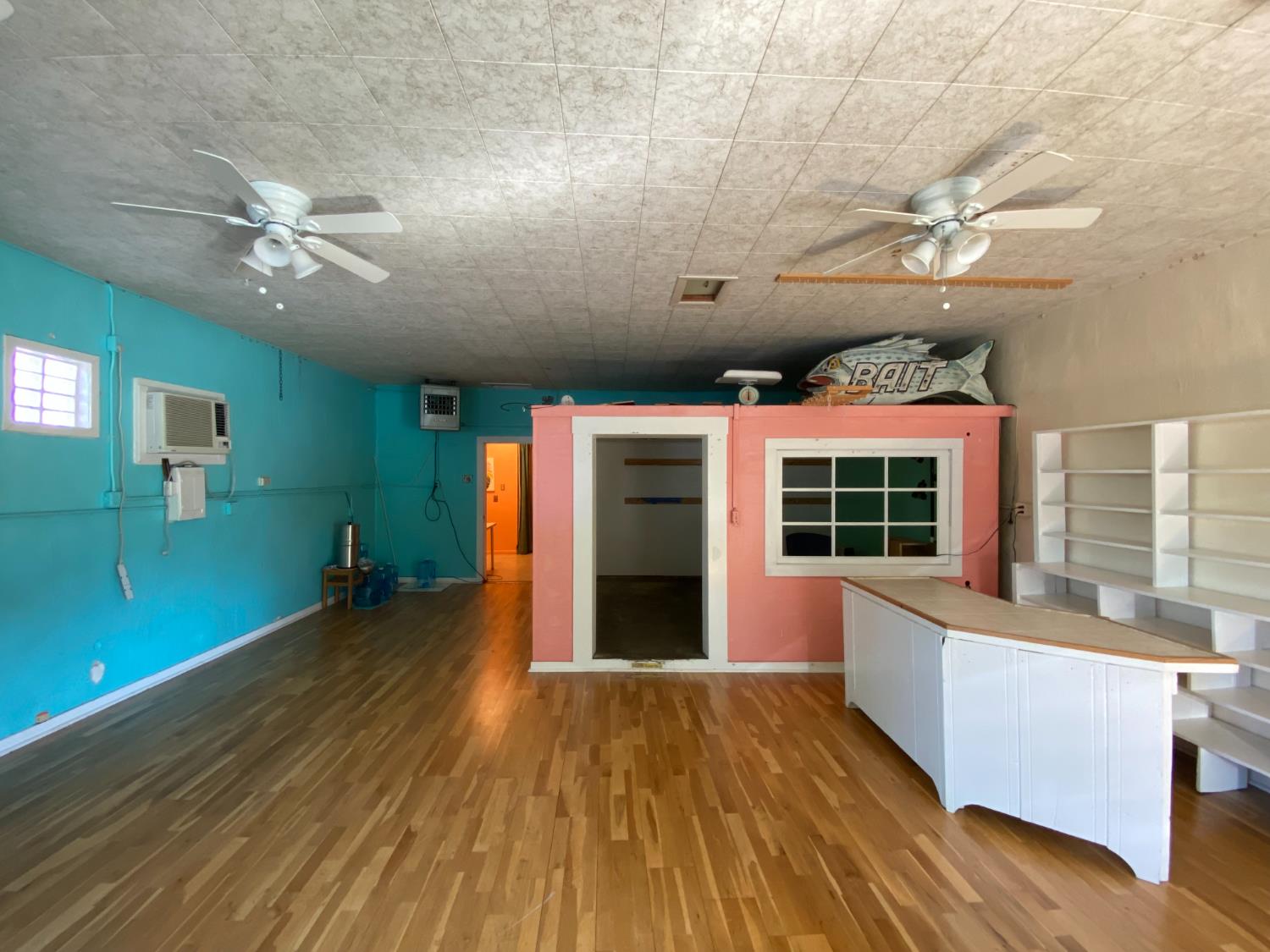 14105 River Road Walnut Grove, CA 95690 - Photo 23 of 41 a view of an empty room with a window and wooden floor
