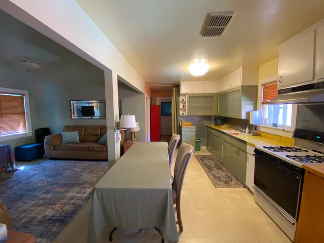 a view of a room with furniture and a window