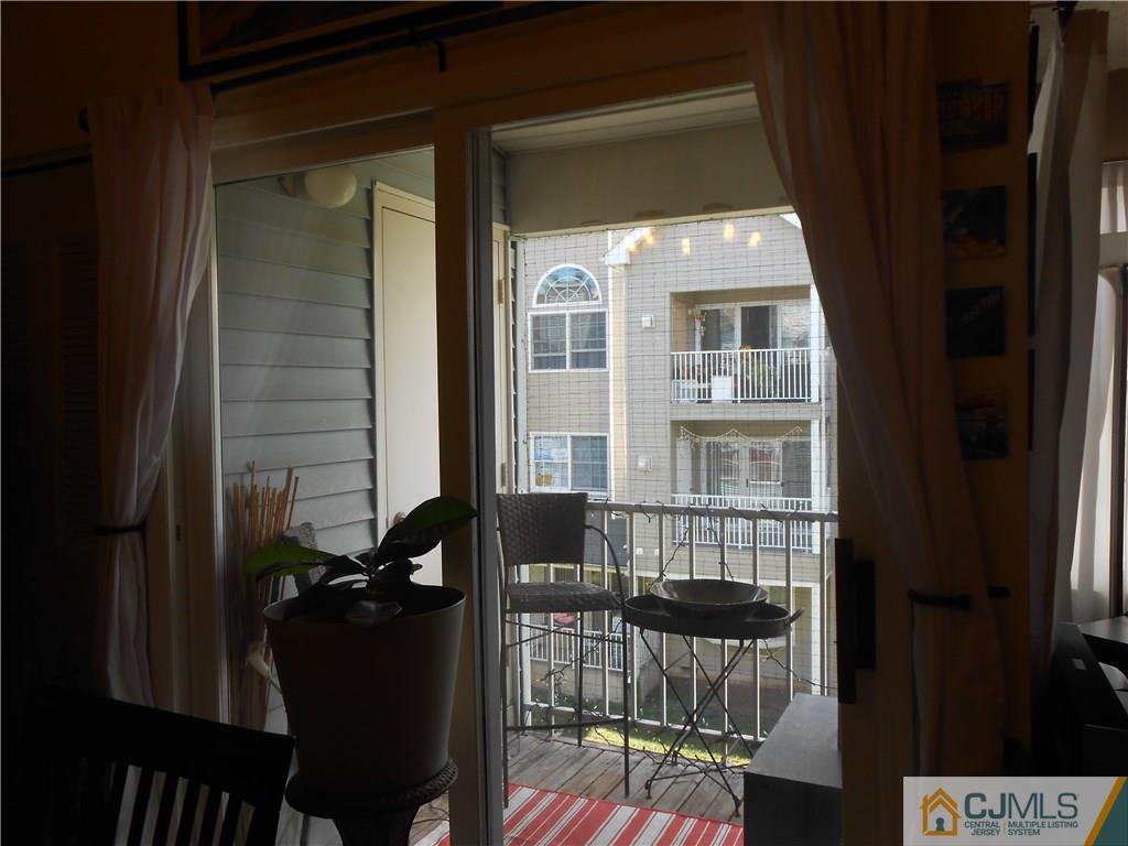 331 Edpas Road New Brunswick, NJ 08901 - Photo 12 of 15 a view of balcony with chair and potted plant