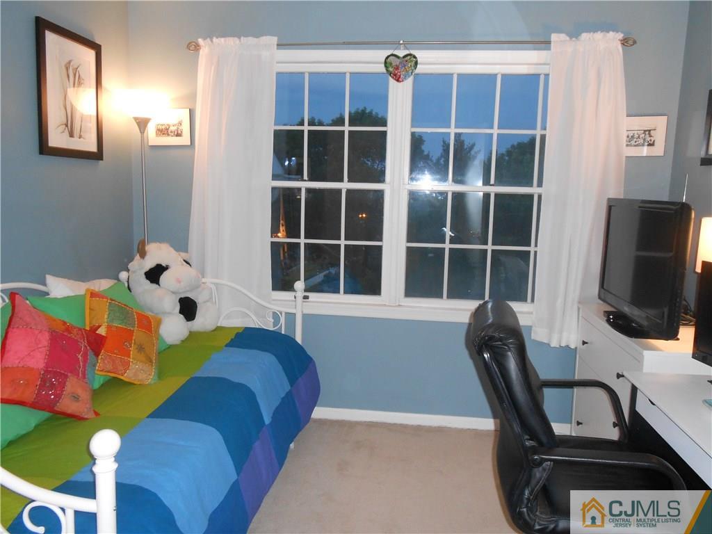 331 Edpas Road New Brunswick, NJ 08901 - Photo 8 of 15 a view of a workspace with furniture and a flat screen tv