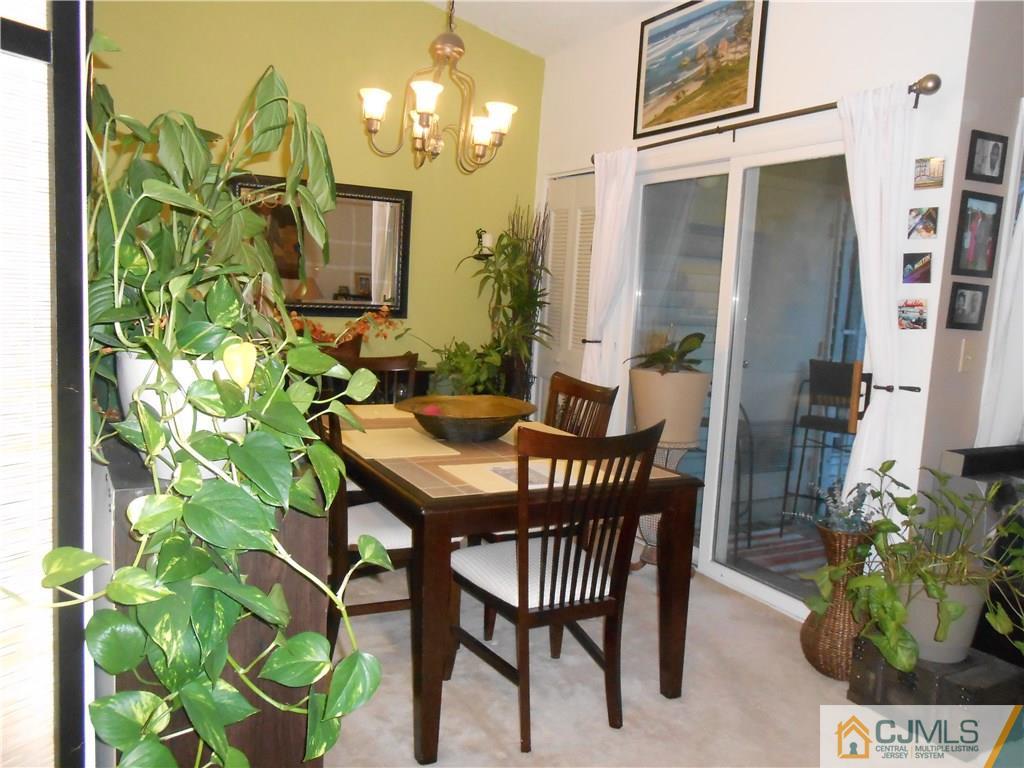 331 Edpas Road New Brunswick, NJ 08901 - Photo 10 of 15 a dining room with furniture a chandelier and wooden floor