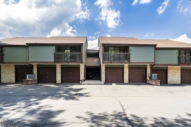 a front view of a house with a garage